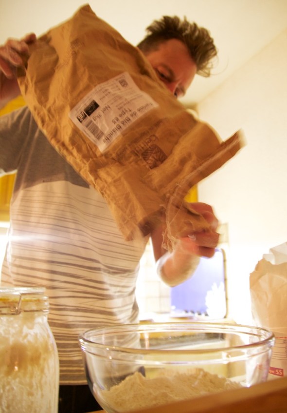 Add the first amount of flour to create the sponge.