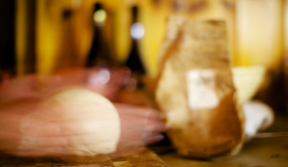After it has risen in the oily bowl it can be knocked back and left to rise several times. I tend to not really bother with the knocking back so will just pull it out and give it a final need and then shape the final loaf. Daniel Stevens (River Cottage Handbook No.3 - Bread) suggests this movement of sliding the heal of the palm at the base of the bread. One hand forward, one back, spinning the loaf and slowly pulling down the sides to pull under the dough. It stretches the top surface and makes a very nice round tight dough. It took a good few attempts to get this process right, but when you have it, it makes a very nice, tight round ball. 