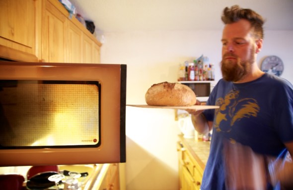 Check on the bread in another 10mins and if it is looking nice and brown all over, you could take it out and give it a tap on the bottom. If you get a nice hollow sound it is done, if it is still a little doughy, you will need to put it in for another 5 or so minutes, or even flip it upside-down to get the bottom to cook through - (We need to do this with our little French oven, small but surprisingly hot). We thought we would never get to make bread in France with this little thing, but were impressed with the first attempt, but realised we needed to halve all our ingredients to fit (or make two loaves). The first attempt was rather forced into the oven, and then ended up spilling over the edges of the tray to make a very ugly (but still quite tasty) loaf. 